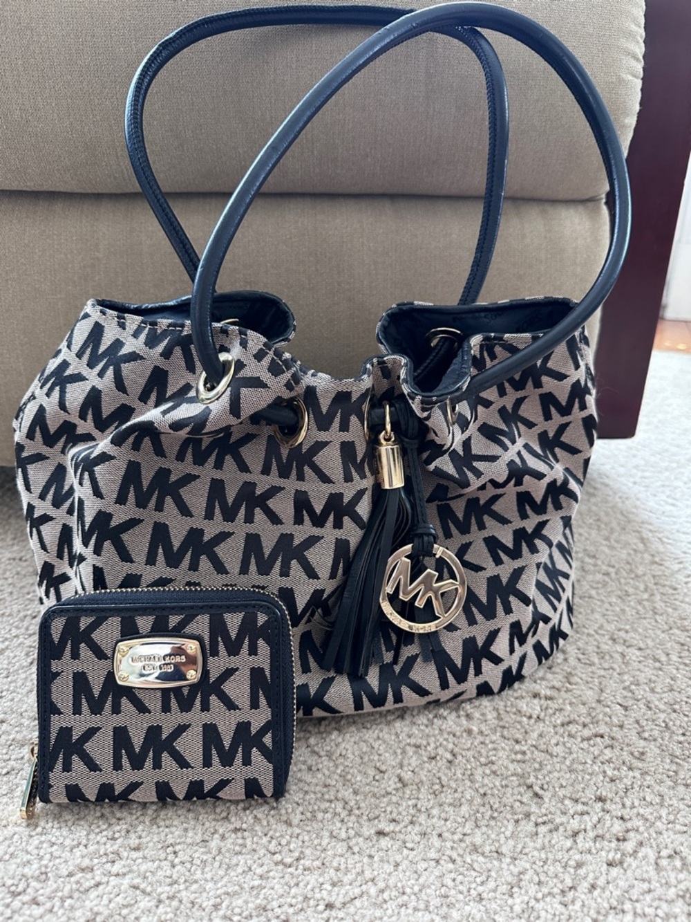 Michael Kors Black and Beige MK Logo Drawstring Tote with Tassel Charm
